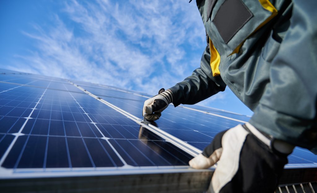 a technician installing solar panels