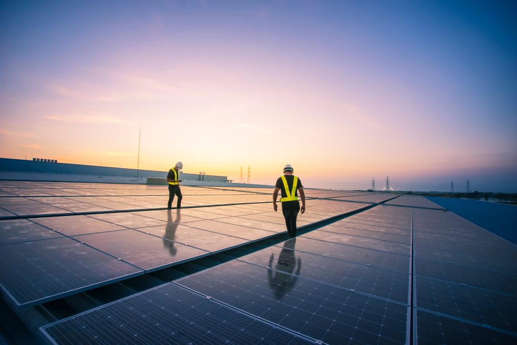 technicians checking the solar panels.