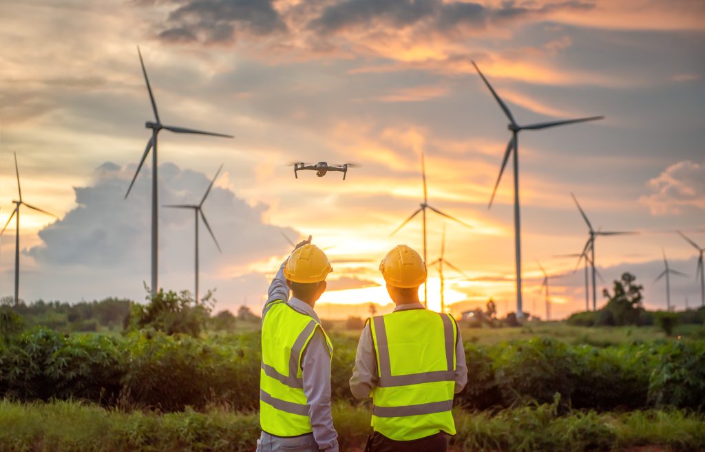 two engineers checking out wind turbines